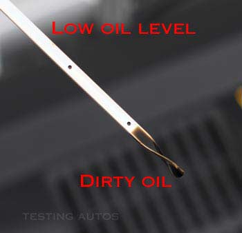 Oil is dirty and the level is low on the dipstick