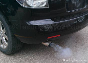 Blue smoke from a car exhaust