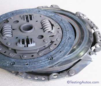 Worn-out clutch disc and pressure plate.